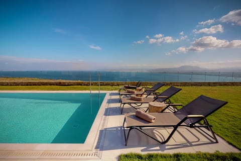 Seasonal outdoor pool, open 7 AM to 7:00 PM, pool umbrellas