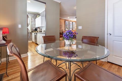 Dining area with pantry looking into kitchen and living area