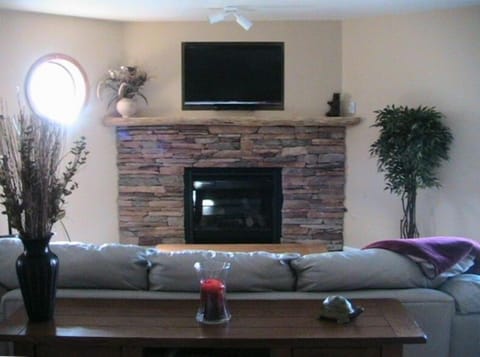 Large, Open Living Room Area with leather Sofa and Lazyboy