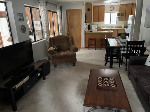 View of family room, dining area, and kitchen.