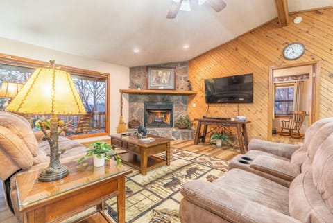Living room with gas fireplace and reclining couches, TV comes with cable/DVD 