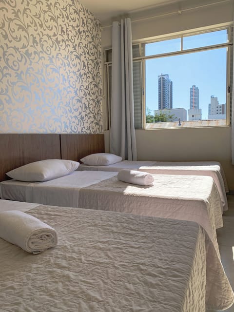 Economy Triple Room | Laptop workspace, blackout drapes, WiFi (free), bed sheets