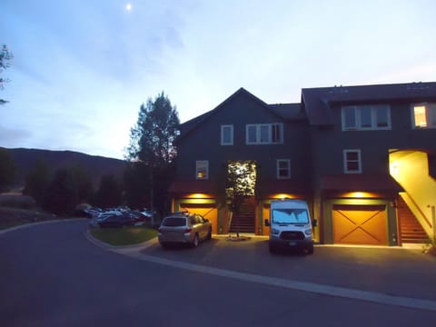 End-unit with parking in front of garage.