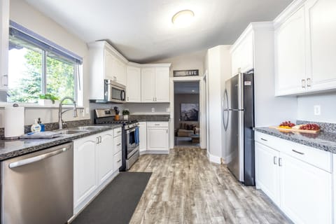 Our fully equipped kitchen is located off the main floor and views the backyard