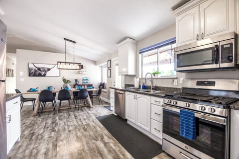 Our fully equipped kitchen is located off the main floor and views the backyard