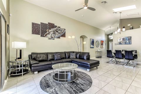 The great room with modern décor, vaulted ceilings and skylights.