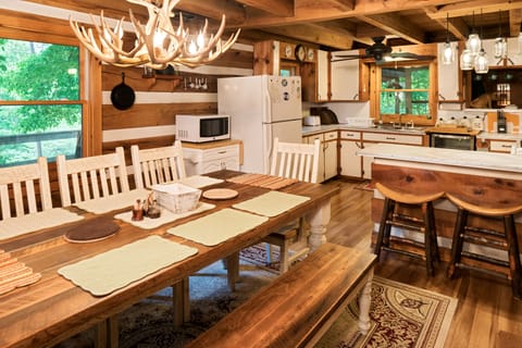 Seating for 12... 8 at the farm table and 4 in the hickory stools at the bar