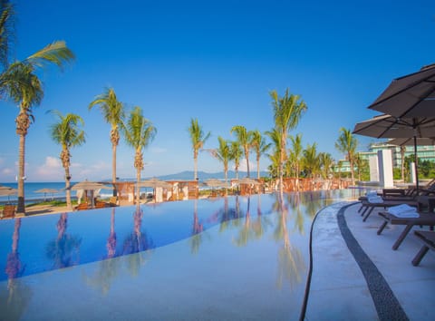 5 outdoor pools, open 7 AM to 8 PM, free cabanas, pool umbrellas
