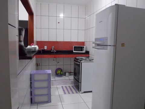 Standard Apartment, Multiple Beds | Private kitchen | Fridge, microwave, oven, stovetop