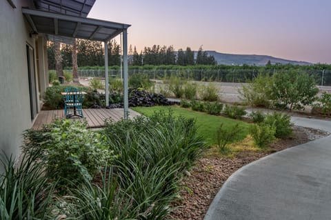 Deluxe Room, Garden View | Balcony view