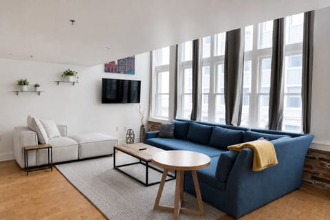 Spacious living room with queen trundle bed sleeper sofa.
