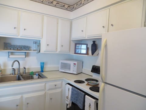 Open concept kitchen with breakfast bar.