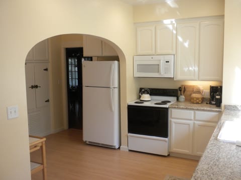 Kitchen cart to the far left has picnic basket for guests use with wine tasting.