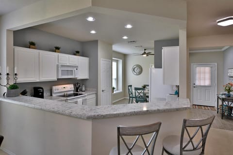 Breakfast Bar for Extra Seating or Serving Bar! Easy-care Quartz Counters!