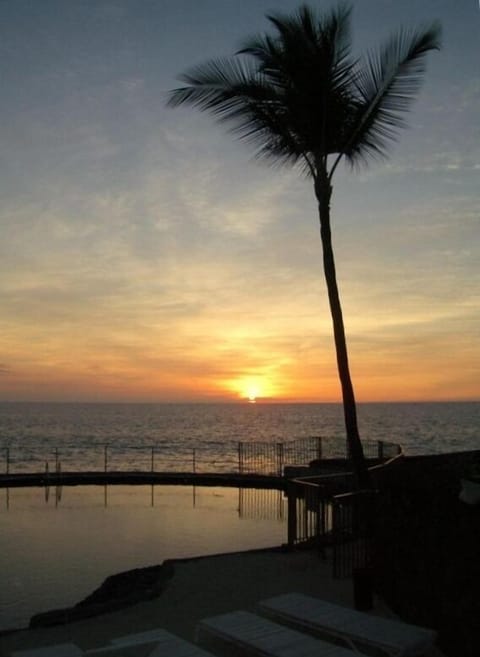 Sunset Over Oceanfront Pool