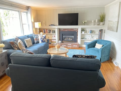 Spacious living room.  Enjoy the gas fireplace in the cooler months 