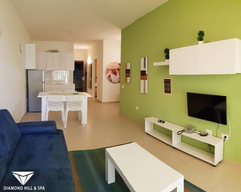 Family Suite, Sea View | Living area | 32-inch flat-screen TV with satellite channels, TV