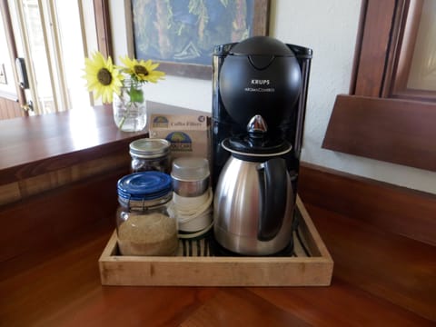 Locally roasted whole organic coffee beans + organic sugar provided.