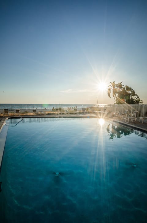 Pool overlooking the beach and sunsets.