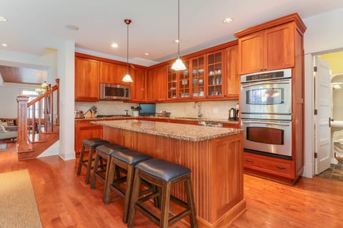 Solid cherry cabinets, natural granite counter tops, stainless steel appliances.