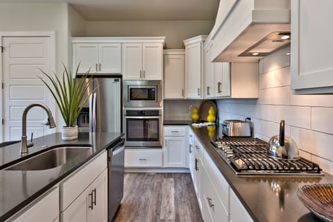 Side View Of Kitchen - Side view of kitchen showing off the beautiful counter tops and stainless steel appliances.