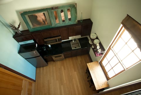 looking down the the kitchen from the mezzanine/ 2nd level
