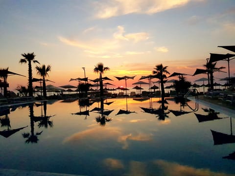 Indoor pool, 2 outdoor pools, open 7:00 AM to 6:00 PM, pool umbrellas