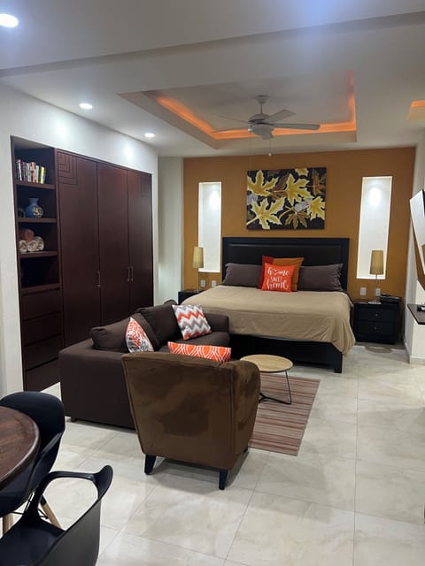 Cozy studio with comfy bed and TV sitting area
