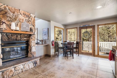 The early birds can enjoy breakfast at this kitchen pub table, or just chat while the family chef is at work