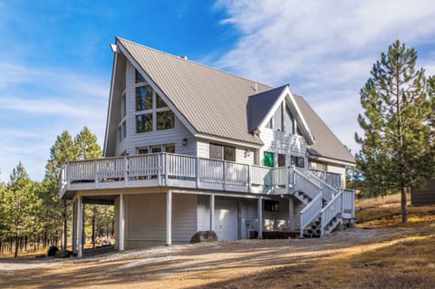 Enjoy the home's wraparound deck and huge wooded yard to make family memories