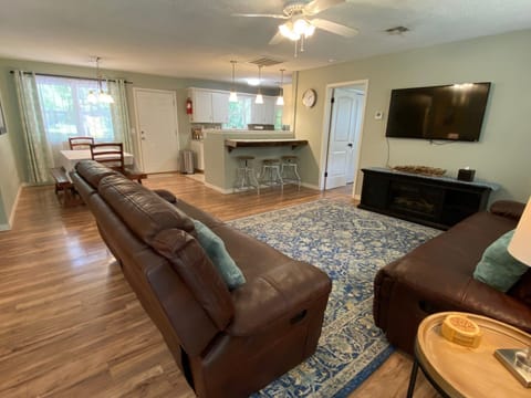 As you enter, living room leads to dining room and kitchen.
