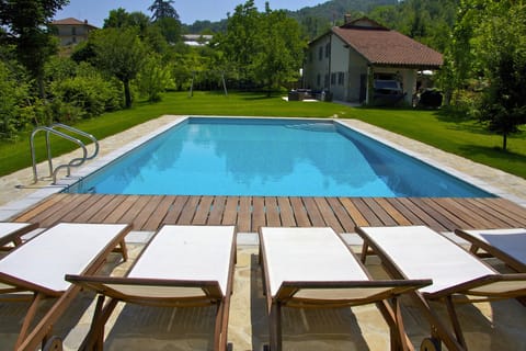 Private pool with villa in background.