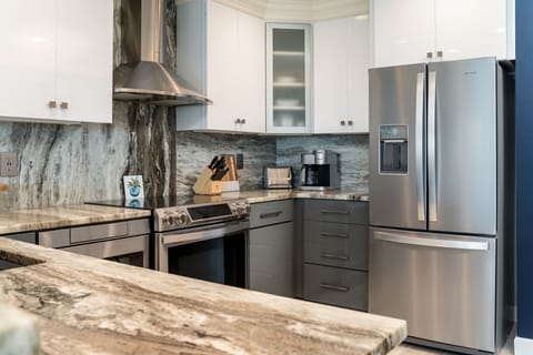 Gourmet kitchen with stainless steel appliance.