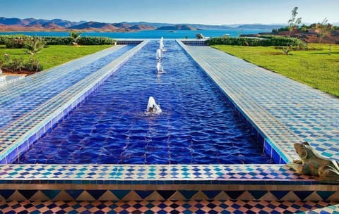 Outdoor pool, pool umbrellas, sun loungers