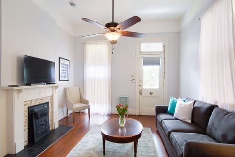 Living room with queen sofa sleeper and large flat screen TV