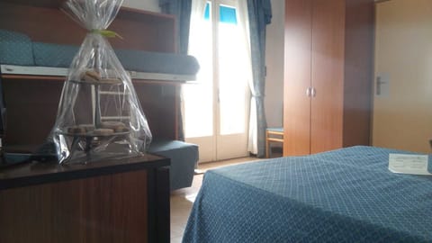 Quadruple Room, Balcony, Sea View | Minibar, in-room safe, desk, bed sheets