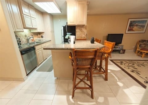 modern kitchen with granite counter tops and stainless apliances