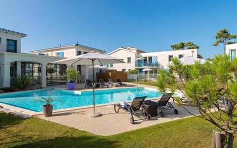 Enjoy the French summer and lounge poolside.