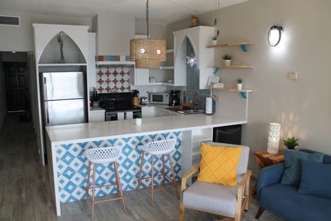 Kitchen with a Mexican-Surfy Vibe.  Fully equipped with most things you should need including a bonus beverage refrigerator!