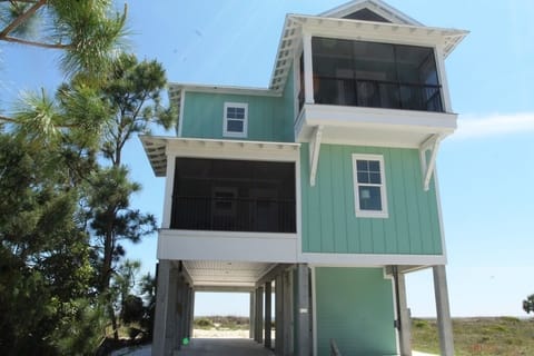View of the home from the road. Plenty of parking underneath the home