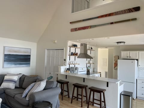 Living room, kitchen, lofted bedroom upstairs.