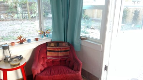 Sun room or Florida room with view of paver patio, live oaks and magnolias