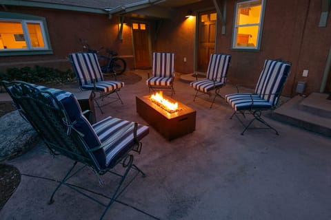 Peaceful gas fire pit in the enclosed courtyard.