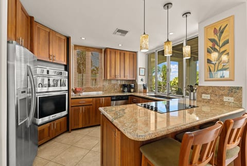 Owners remodeled the kitchen with granite and eucalyptus cabinets.