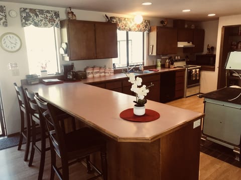 Enjoy a large kitchen, bars seats 4, and my great grandmothers antique stove
