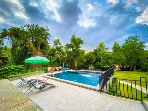 Outdoor pool, open 7 AM to 10 PM, pool umbrellas, sun loungers