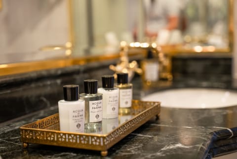 Separate tub and shower, designer toiletries, hair dryer, bathrobes