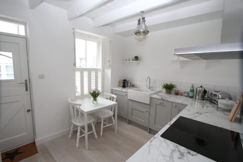 The bright kitchen with Neff and Dualit appliances & Nespresso coffee machine