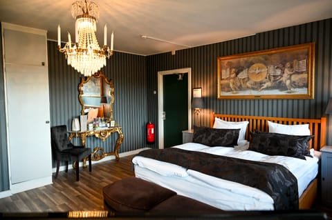 Family Room, Multiple Beds, Balcony, Courtyard Area | Premium bedding, minibar, individually decorated, individually furnished