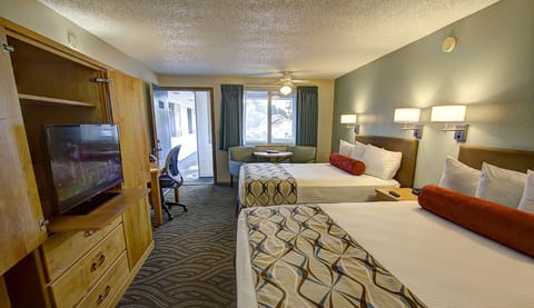 Standard Room, 2 Queen Beds | Living area | 32-inch flat-screen TV with cable channels, TV